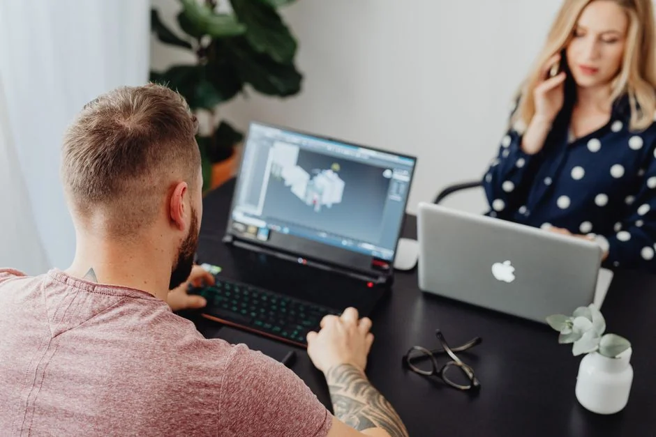 A contemporary workspace showcasing a laptop, tablet, and smartphones, ideal for tech and freelance use.